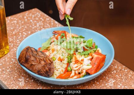 Beef steak with salad rice on a plate Stock Photo