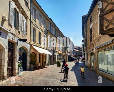 France, Ain departement, Auvergne - Rhone - Alpes région. In the old town of Bourg-en- Bresse, the shopping streets are pedestian, Cityscape,and have kept their traditional habitat Stock Photo