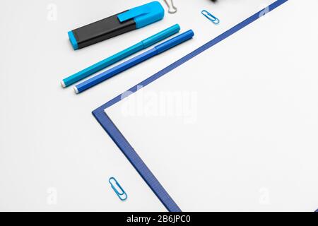 Clipboard with white sheet and pen isolated on a white background. Top view Stock Photo