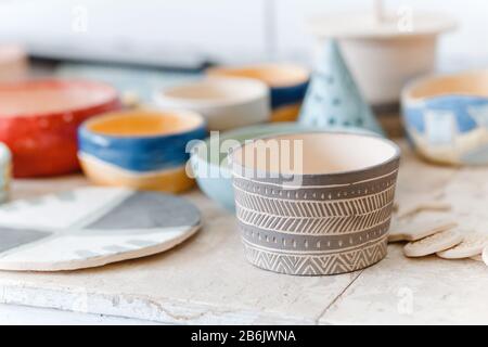 Empty clay pots drying on a shelf Stock Photo