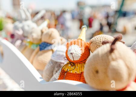 small knitted baby toys for sale at outdoor handmade market Stock Photo