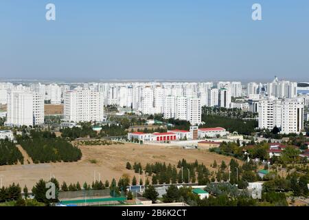 Skyline of white marble buildings in Ashgabat, the capital of Turkmenistan in Central Asia. Luxury residential buildings, also know as the white city. Stock Photo