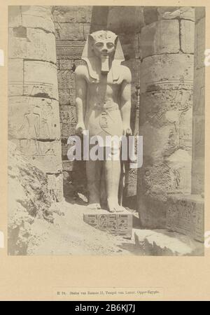 An image of Ramses II E 78 Statue of Ramses II, Temple of Luxor Upper Egypt (title object) The photograph is part of the Richard Polak collected photo series from Egypte. Manufacturer : Photographer: Antonio Beato (listed property) Place manufacture: Egypt Date: ca. 1895 - ca. 1915 Physical features: photo on cardboard with onderschrift. Material : photo paper, paper carton Technique: albumin pressure dimensions: image: h 278 mm × W 219 mmblad: h 555 mm × W 466 mm Stock Photo