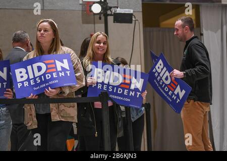 Joe Biden supporters holding political signs wait for the former Vice President of the United States of America to speak at the National Convention Center during primary voting - Stock Photo