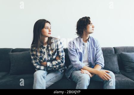 Woman gesturing while quarreling with her partner in the living room Stock Photo