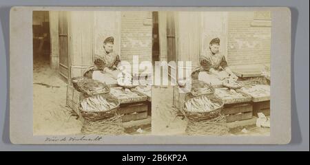 A woman makes cleaning fish on the fish market at the Nieuwmarkt, Amsterdam A woman makes fish cleaning the fish market at the Nieuwmarkt, Amsterdam Property Type: Stereo picture Item number: RP-F F11733 Inscriptions / Brands: inscription, recto, handwritten: "Before Vischmarkt'opschrift, verso, handwritten" Old. Amsterdam./ Vischmarkt in New Markt.' Manufacturer : Photographer: anonymous place manufacture: Amsterdam Date: 1890 - 1920 Material: cardboard paper Technique: daylight gelatin silver print dimensions: Secondary medium: H 86 mm × W 176 mm Subject: cleaning (food) - CC - in the open a Stock Photo