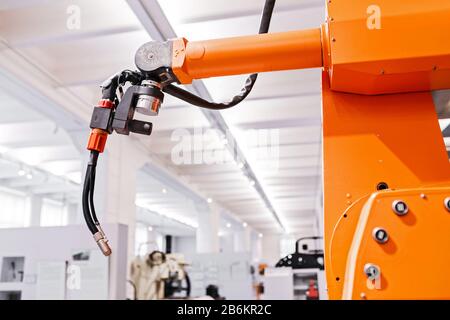 Automated robotic arm for welding on modern equipment factories Stock Photo
