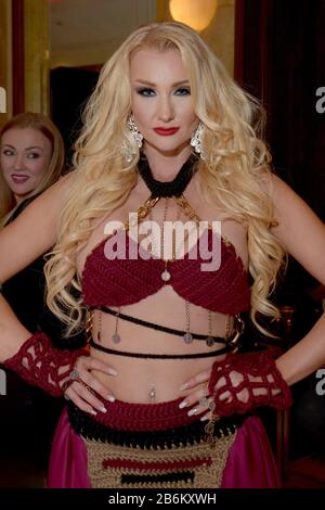 mMODEL WEARING SOLID PURPLE DRESS Stock Photo