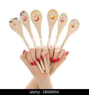 Funny wooden spoons in hands isolated over white background Stock Photo