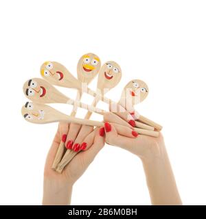 Funny wooden spoons in hands isolated over white background Stock Photo