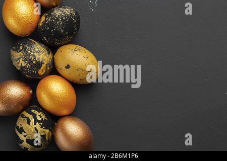 Background with golden decorated easter eggs Stock Photo