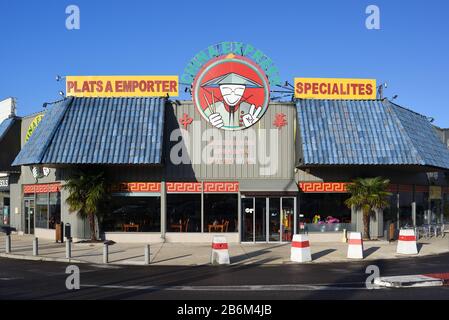 China Express Chinese Restaurant with Logo or Caricature of Chinese Man or Chinaman with Chopsticks, Conical Hat & Traditional Chinese Costume Stock Photo