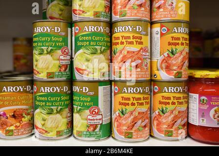 Display of Tins or Cans of Chinese Soup or Asian Soup including Tom Yum Soup & Green Curry Soup in Chinese or Asian Supermarket Stock Photo