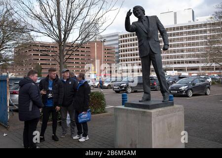 Home fans gathering next to the statue to former manager Sir Bobby Robson outside the stadium before Ipswich Town play Oxford United in a SkyBet League One fixture at Portman Road. Both teams were in contention for promotion as the season entered its final months. The visitors won the match 1-0 through a 44th-minute Matty Taylor goal, watched by a crowd of 19,363. Stock Photo