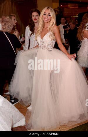 mMODEL WEARING SOLID PURPLE DRESS Stock Photo