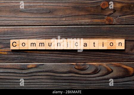 COMMUNICATION word written on wood block. COMMUNICATION text on wooden table for your desing, concept. Stock Photo
