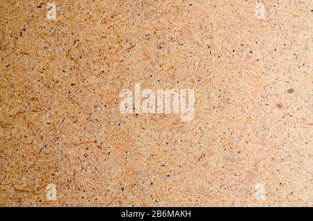 Recycled Brown Paper Background. Pressed chipboard. View from above. Abstract multitask background. Stock Photo