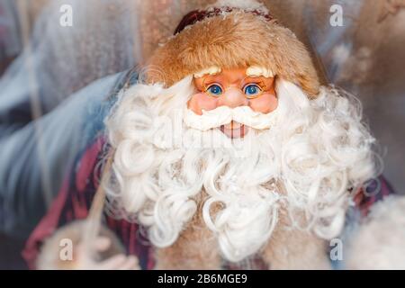 Santa Claus doll in window Stock Photo