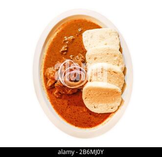 Isolated plate with goulash and dumplings is a traditional Czech dish Stock Photo