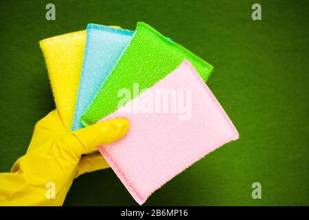 Product for professional cleaning on green background Stock Photo