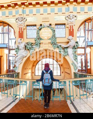 DECEMBER 2017, PRAGUE, CZECH REPUBLIC: Interior hall in classic retro style in Prague main railway station with tourist Stock Photo
