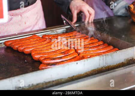 Sausages cooked on bbq, street food for sale Stock Photo