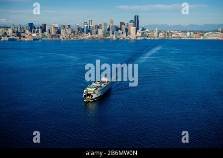 Aerial view of waterfront skyline of city of Seattle and Bainbridge Island ferry, Washington State, USA