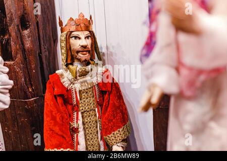 Colorful wooden puppets dolls in the shop Stock Photo