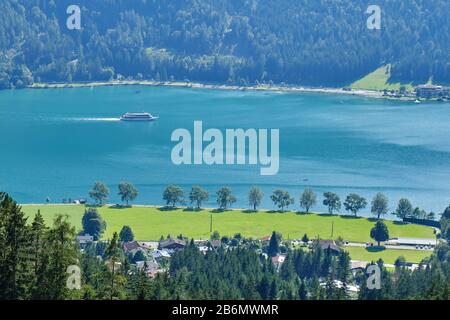 Cruise ship on Achen lake (Achensee), Austria, on a sunny Summer day - view from an elevated vantage point. Stock Photo