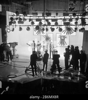 The Beatles on stage at the Scala Theatre, London, when making their first film. (L-R) Paul McCartney, George Harrison, Ringo Starr and John Lennon. Police were called to guard the doors of the theatre as hundreds of fans clamoured outside Stock Photo