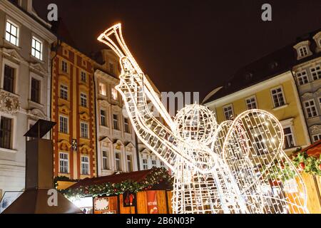 Christmas angel of light bulbs as New Year decoration on a Prague city street Stock Photo