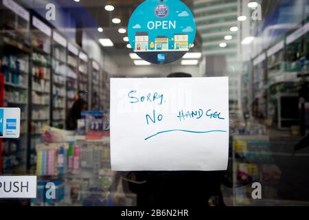 Tottenham Court Road, Central London. Chemist's shop. Sign saying no hand gel Stock Photo