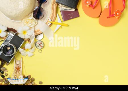 Summer vacation concept flat lay. Hat with sunglasses, slippers and Beach accessories top view. Space for text. travel Stock Photo