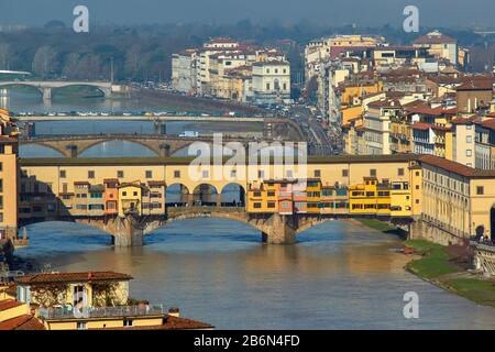 FLORENCE ITALY CITY VIEW WITH BRIDGES OVER THE RIVER ARNO THE COLOURED PONTE VECCHIO IN THE FOREGROUND Stock Photo