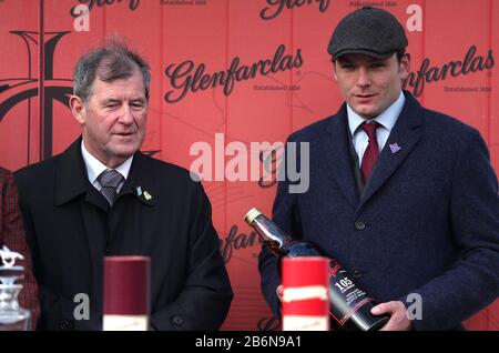 Winning owner John P. McManus (left) and trainer David Cottin after the Glenfarclas Chase during day two of the Cheltenham Festival at Cheltenham Racecourse. Stock Photo