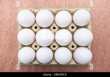 Twelve white eggs from above Stock Photo