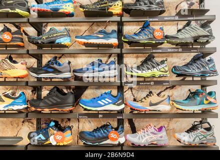 Trail running shoes store display. Stock Photo