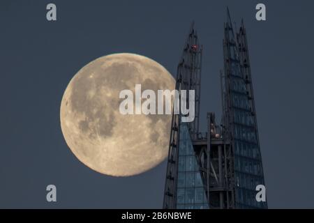 Supermoon Shines Brightly behind Londons stunning Shard building Stock Photo