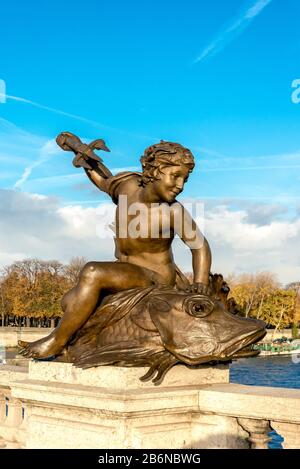 One of the nymph sculptures on the Alexander III bridge across Seine river in Paris city centre, France
