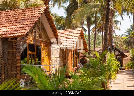 Beach huts and cottages made from bamboo, clay tiles and coconut leaves. Holiday destination concept image in Goa, India.vacation and travel images Stock Photo