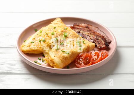 Delicious breakfast or lunch with omelette on wooden background, close up Stock Photo