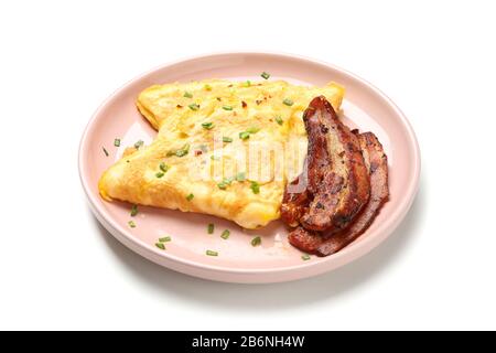 Plate with omelette and bacon isolated on white background Stock Photo