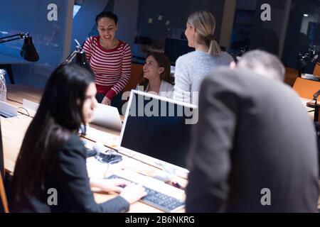 Meeting of co-workers and planning next steps of work. Young business group in discussion in their office. Startup people working in office. Stock Photo
