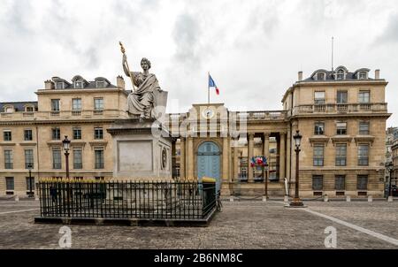 Antique sculpture surrounded by a fence in front of National Assembly building, Paris, France Stock Photo