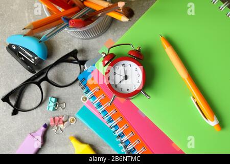 Different stationary on grey background, top view. Study concept Stock Photo