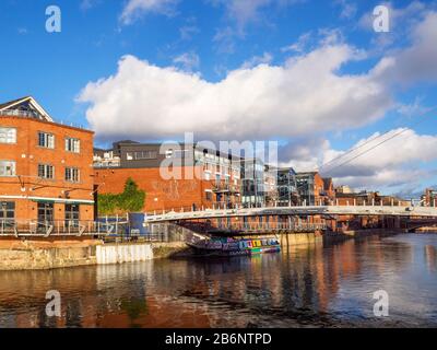 Centenery Bridge a modern pedestrian bridge over the River Aire in Leeds West Yorkshire England Stock Photo