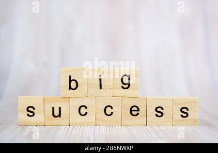 Big success word from wooden blocks on desk. Concept of successful in business Stock Photo