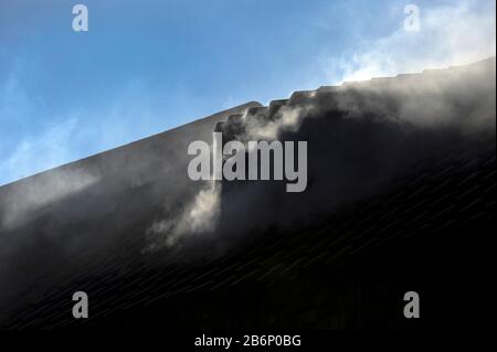 Smoke coming out of kipper smokehouse, Craster Stock Photo