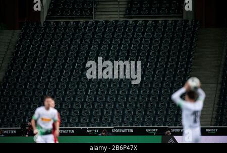 Monchengladach, Germany. 11th Mar, 2020. 11 March 2020, North Rhine-Westphalia, Mönchengladbach: Football: Bundesliga, Borussia Mönchengladbach - 1 FC Cologne, 21st matchday at Borussia-Park. The seats on the stands in the stadium are empty during the ghost game. Due to the coronavirus, the game will take place without spectators as a ghost game. Photo: Fabian Strauch/dpa - IMPORTANT NOTE: In accordance with the regulations of the DFL Deutsche Fußball Liga and the DFB Deutscher Fußball-Bund, it is prohibited to exploit or have exploited in the stadium and/or from the game taken photographs in  Stock Photo