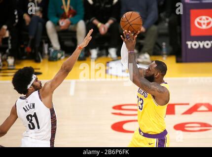 Los Angeles, California, USA. 10th Mar, 2020. Los Angeles Lakers' LeBron James (23) shoots against Brooklyn Nets center Jarrett Allen (31) during an NBA basketball game between Los Angeles Lakers and Brooklyn Nets, Tuesday, March 10, 2020, in Los Angeles. Credit: Ringo Chiu/ZUMA Wire/Alamy Live News Stock Photo